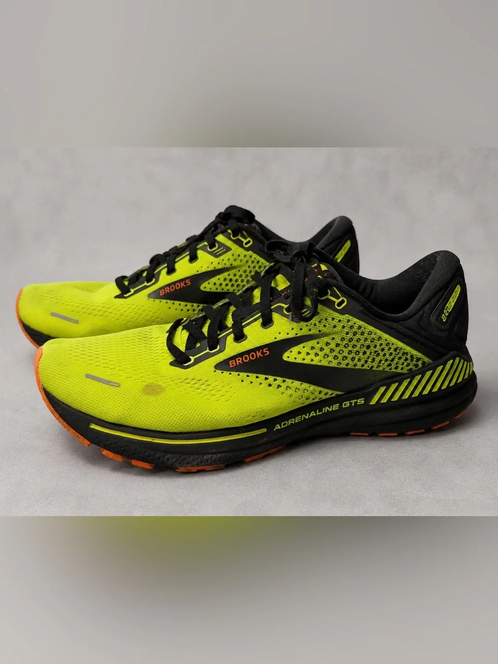 Brooks Adrenaline GTS 22 men's running shoes in a bright neon yellow, black